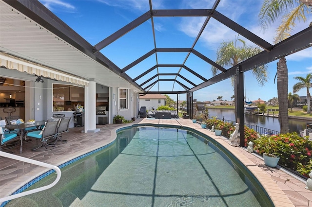 5001 Almar Dr, Punta Gorda, FL 33950 - swimming pool featuring a patio, a water view, and glass enclosure