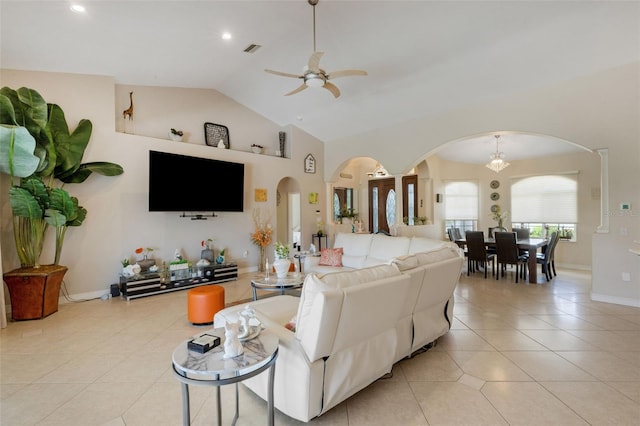 5001 Almar Dr, Punta Gorda, FL 33950 - living area with arched walkways, ceiling fan, light tile patterned floors, high vaulted ceiling, and recessed lighting
