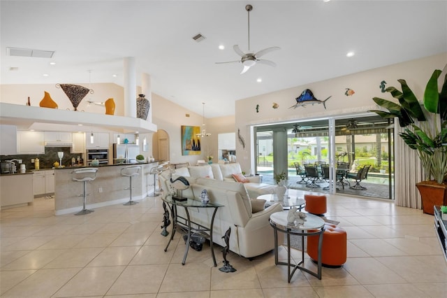 5001 Almar Dr, Punta Gorda, FL 33950 - living room with a ceiling fan, high vaulted ceiling, arched walkways, light tile patterned floors, and recessed lighting