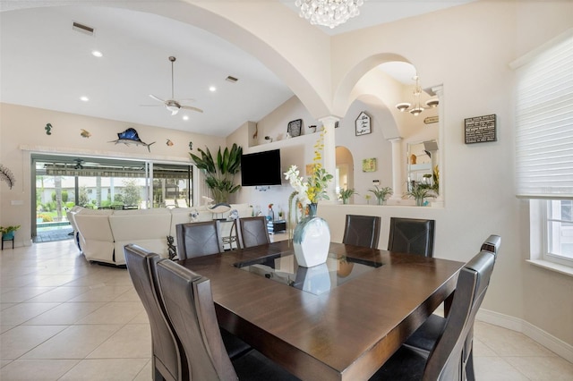 5001 Almar Dr, Punta Gorda, FL 33950 - dining area featuring light tile patterned floors, vaulted ceiling, a chandelier, a ceiling fan, and arched walkways
