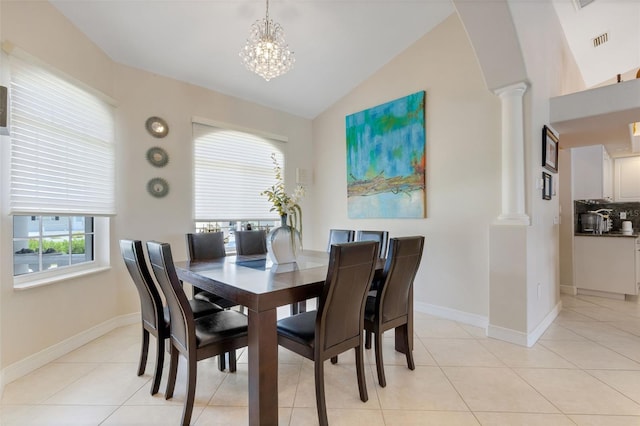 5001 Almar Dr, Punta Gorda, FL 33950 - dining area with ornate columns, lofted ceiling, a chandelier, light tile patterned floors, and arched walkways