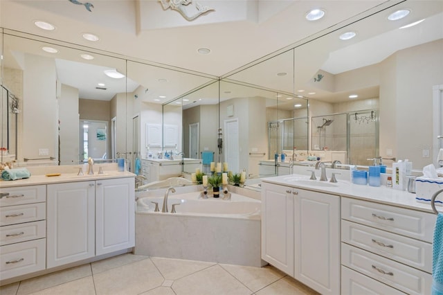 5001 Almar Dr, Punta Gorda, FL 33950 - full bathroom with a stall shower, a garden tub, two vanities, recessed lighting, and tile patterned floors