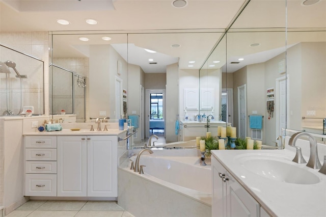 5001 Almar Dr, Punta Gorda, FL 33950 - full bath featuring a garden tub, two vanities, a shower stall, recessed lighting, and tile patterned floors