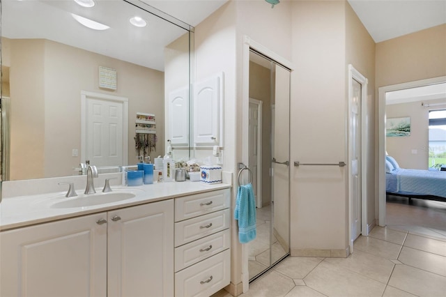 5001 Almar Dr, Punta Gorda, FL 33950 - bathroom featuring connected bathroom, vanity, tile patterned floors, recessed lighting, and a closet