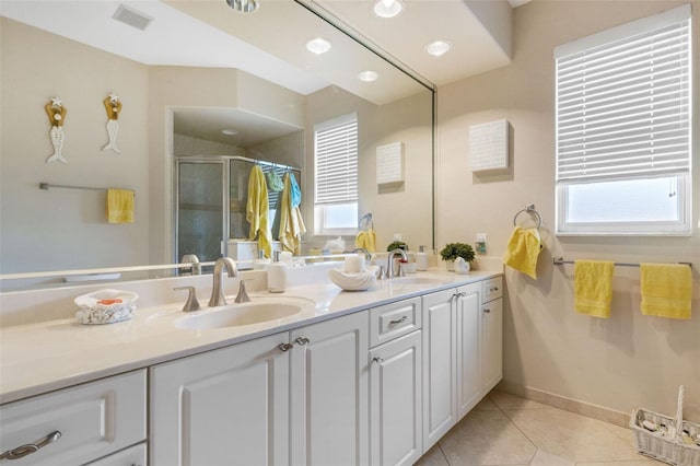 5001 Almar Dr, Punta Gorda, FL 33950 - full bath featuring double vanity, a shower stall, healthy amount of natural light, and tile patterned flooring
