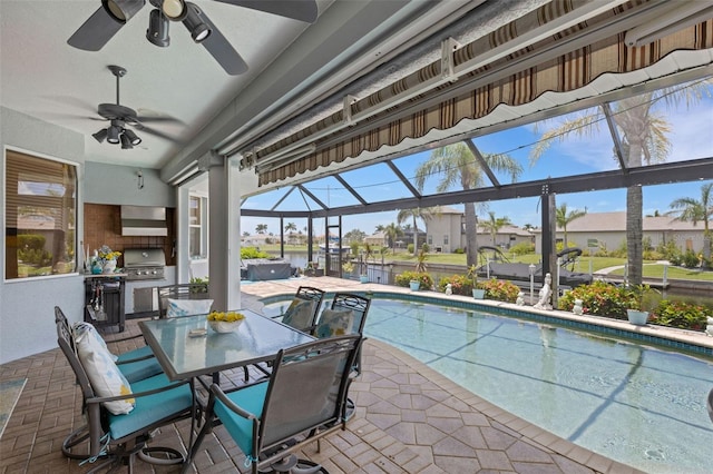 5001 Almar Dr, Punta Gorda, FL 33950 - swimming pool featuring an outdoor kitchen, a patio, ceiling fan, and outdoor dining area