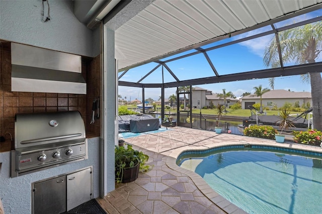 5001 Almar Dr, Punta Gorda, FL 33950 - swimming pool with grilling area, a patio area, glass enclosure, a residential view, and a water view