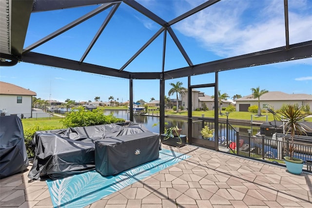 5001 Almar Dr, Punta Gorda, FL 33950 - view of patio / terrace featuring a water view, a residential view, and glass enclosure