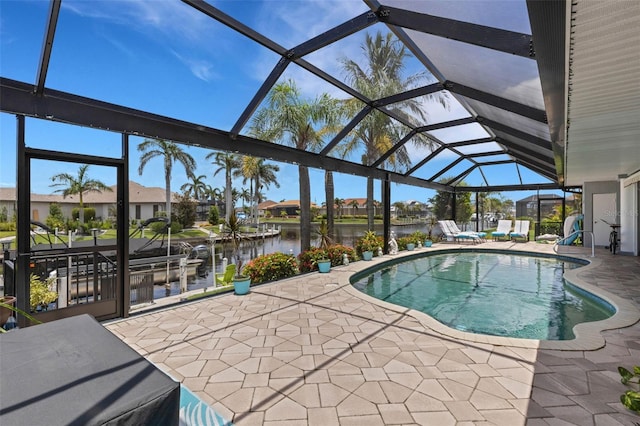 5001 Almar Dr, Punta Gorda, FL 33950 - outdoor pool with a patio area, a water view, and glass enclosure