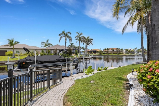 5001 Almar Dr, Punta Gorda, FL 33950 - dock area featuring boat lift, a residential view, a yard, and a water view