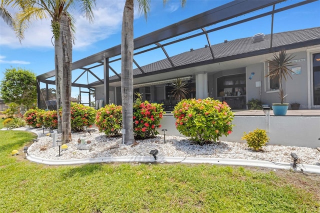 5001 Almar Dr, Punta Gorda, FL 33950 - rear view of house featuring a lanai, a yard, and stucco siding