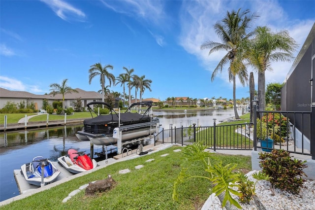 5001 Almar Dr, Punta Gorda, FL 33950 - dock area with boat lift, a water view, a yard, and a residential view