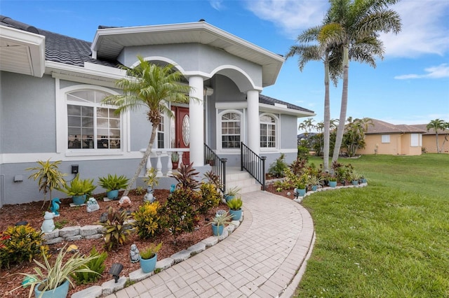 5001 Almar Dr, Punta Gorda, FL 33950 - view of front of home with stucco siding and a front lawn