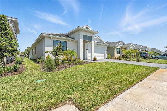 18525 Midsummer Pl, Venice, FL 34293 - single story home featuring a garage, a front yard, stucco siding, and driveway