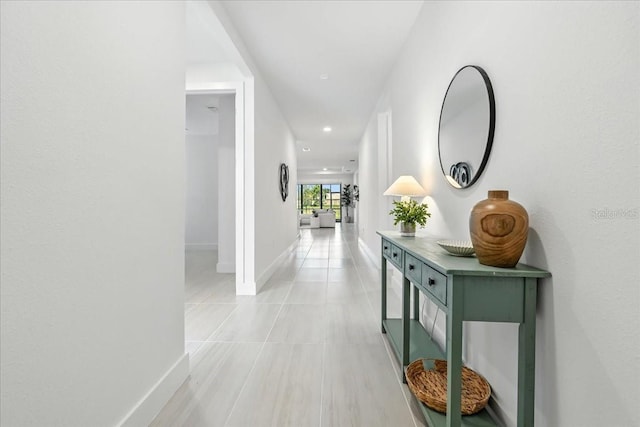 18525 Midsummer Pl, Venice, FL 34293 - hall with recessed lighting and light tile patterned floors