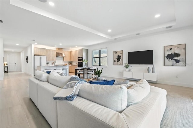 18525 Midsummer Pl, Venice, FL 34293 - living room featuring recessed lighting and a raised ceiling