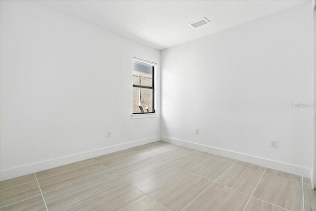 18525 Midsummer Pl, Venice, FL 34293 - empty room featuring baseboards