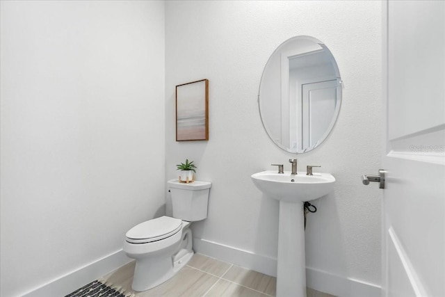 18525 Midsummer Pl, Venice, FL 34293 - half bath featuring tile patterned floors and baseboards