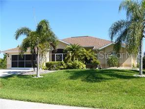 15140 Lyneburg Ave, Port Charlotte, FL 33981 - view of front of house with a front yard