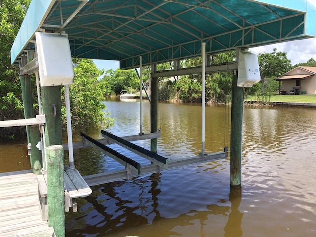 15140 Lyneburg Ave, Port Charlotte, FL 33981 - dock featuring boat lift and a water view