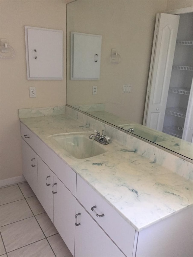 15140 Lyneburg Ave, Port Charlotte, FL 33981 - bathroom featuring vanity and tile patterned floors