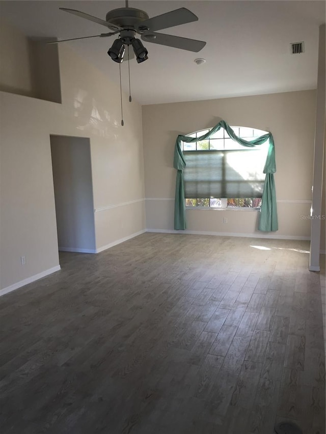 15140 Lyneburg Ave, Port Charlotte, FL 33981 - spare room with a ceiling fan and dark wood finished floors