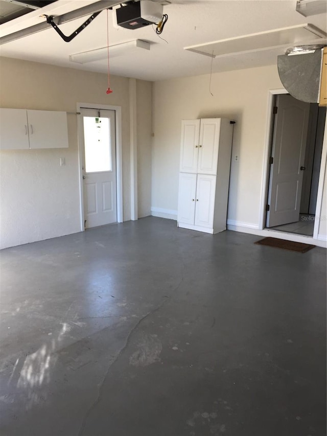 15140 Lyneburg Ave, Port Charlotte, FL 33981 - garage featuring a garage door opener