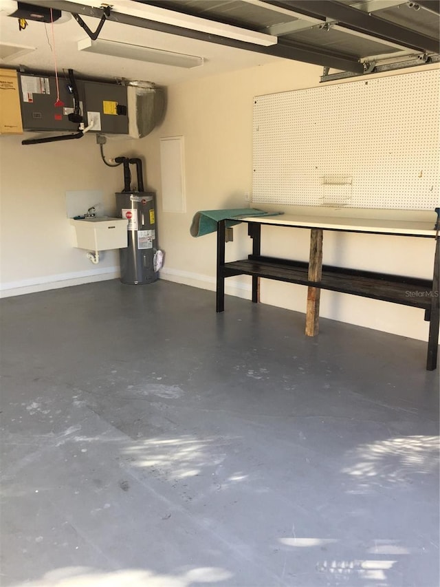 15140 Lyneburg Ave, Port Charlotte, FL 33981 - garage with water heater and a workshop area