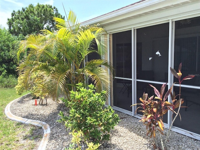 15140 Lyneburg Ave, Port Charlotte, FL 33981 - view of side of home with a sunroom