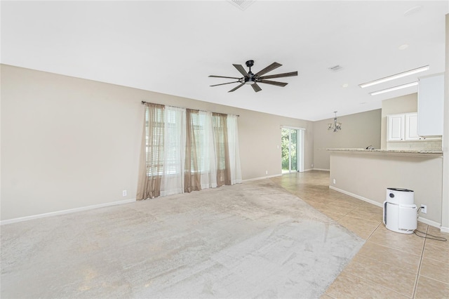 2631 S Cranberry Blvd, North Port, FL 34286 - unfurnished living room featuring ceiling fan, light tile patterned flooring, and lofted ceiling