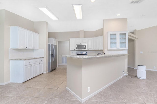 2631 S Cranberry Blvd, North Port, FL 34286 - kitchen featuring stainless steel appliances, light tile patterned flooring, white cabinets, and recessed lighting