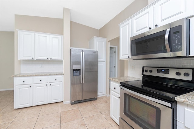 2631 S Cranberry Blvd, North Port, FL 34286 - kitchen with stainless steel appliances, decorative backsplash, white cabinets, and light stone countertops