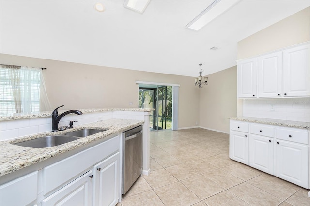 2631 S Cranberry Blvd, North Port, FL 34286 - kitchen with dishwasher, backsplash, light tile patterned flooring, white cabinets, and a chandelier