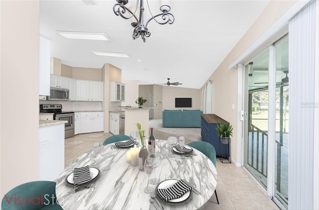 2631 S Cranberry Blvd, North Port, FL 34286 - dining space with a chandelier, lofted ceiling, ceiling fan, and light tile patterned floors