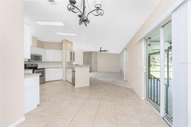 2631 S Cranberry Blvd, North Port, FL 34286 - kitchen featuring appliances with stainless steel finishes, a chandelier, vaulted ceiling, open floor plan, and a peninsula