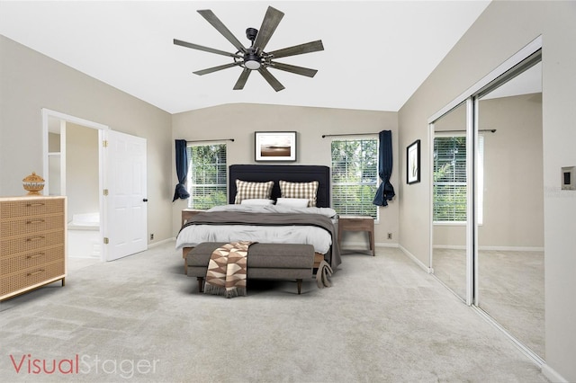 2631 S Cranberry Blvd, North Port, FL 34286 - bedroom with carpet, multiple windows, vaulted ceiling, a closet, and a ceiling fan
