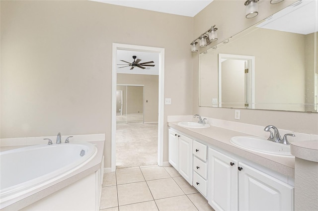 2631 S Cranberry Blvd, North Port, FL 34286 - full bath with double vanity, tile patterned floors, a garden tub, and a ceiling fan