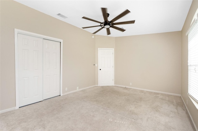 2631 S Cranberry Blvd, North Port, FL 34286 - unfurnished bedroom with light carpet, a closet, and multiple windows