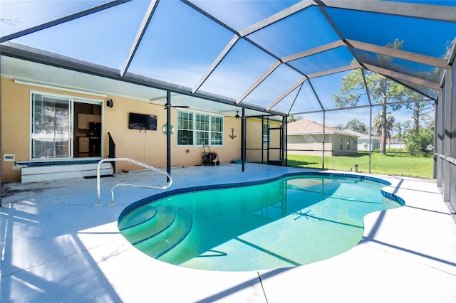 2631 S Cranberry Blvd, North Port, FL 34286 - swimming pool featuring a patio area, ceiling fan, glass enclosure, and a lawn