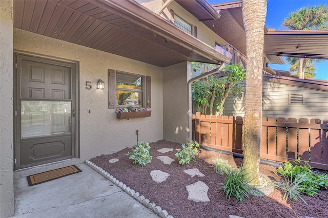 927 Capri Isles Blvd Unit 5, Venice, FL 34292 - property entrance with stucco siding