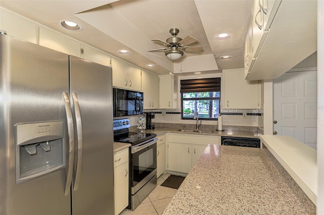 927 Capri Isles Blvd Unit 5, Venice, FL 34292 - kitchen featuring stainless steel appliances, a raised ceiling, recessed lighting, ceiling fan, and light tile patterned floors