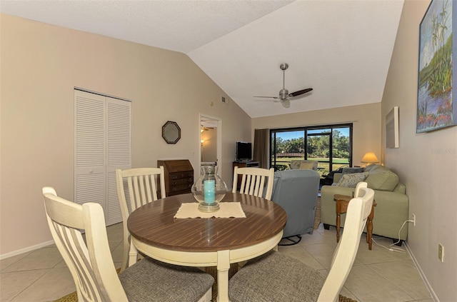 927 Capri Isles Blvd Unit 5, Venice, FL 34292 - dining room featuring light tile patterned flooring, a ceiling fan, and high vaulted ceiling