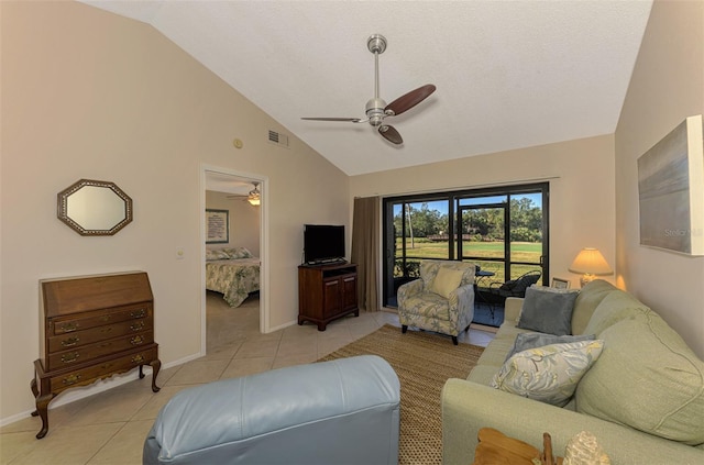 927 Capri Isles Blvd Unit 5, Venice, FL 34292 - living area with a ceiling fan, light tile patterned floors, and high vaulted ceiling