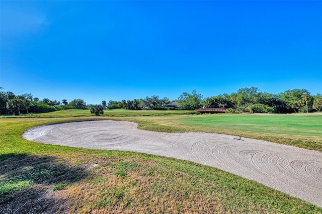 927 Capri Isles Blvd Unit 5, Venice, FL 34292 - view of property's community featuring a yard and view of scattered trees