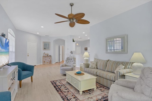 4841 Whispering Oaks Dr, North Port, FL 34287 - living area with arched walkways, a ceiling fan, light wood-style floors, and recessed lighting