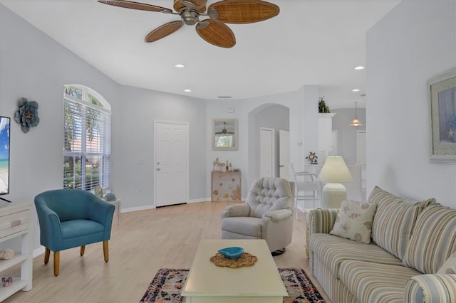 4841 Whispering Oaks Dr, North Port, FL 34287 - living area featuring arched walkways, a ceiling fan, recessed lighting, and light wood-type flooring