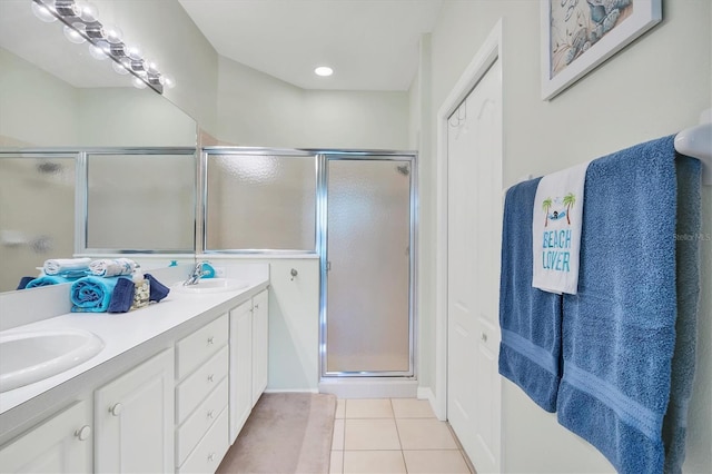 4841 Whispering Oaks Dr, North Port, FL 34287 - full bathroom featuring tile patterned floors, double vanity, and a stall shower