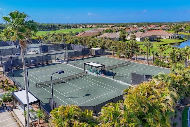 4841 Whispering Oaks Dr, North Port, FL 34287 - view of tennis court with a water view
