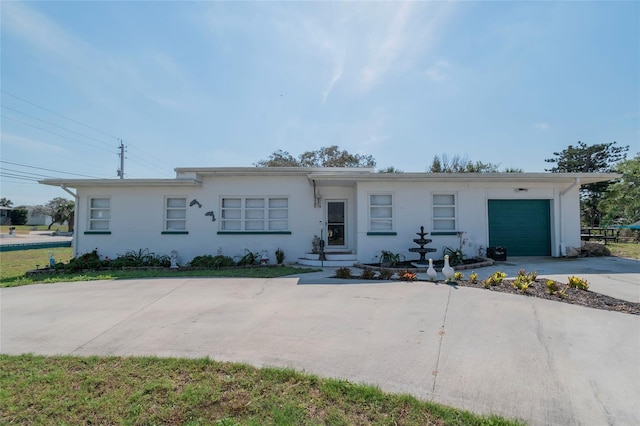 single story home featuring a garage