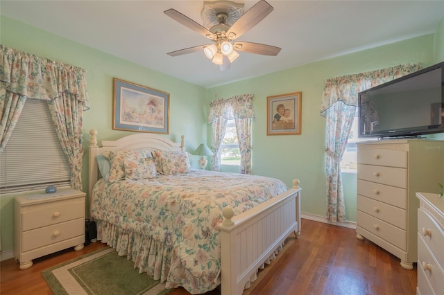 bedroom with wood-type flooring and ceiling fan